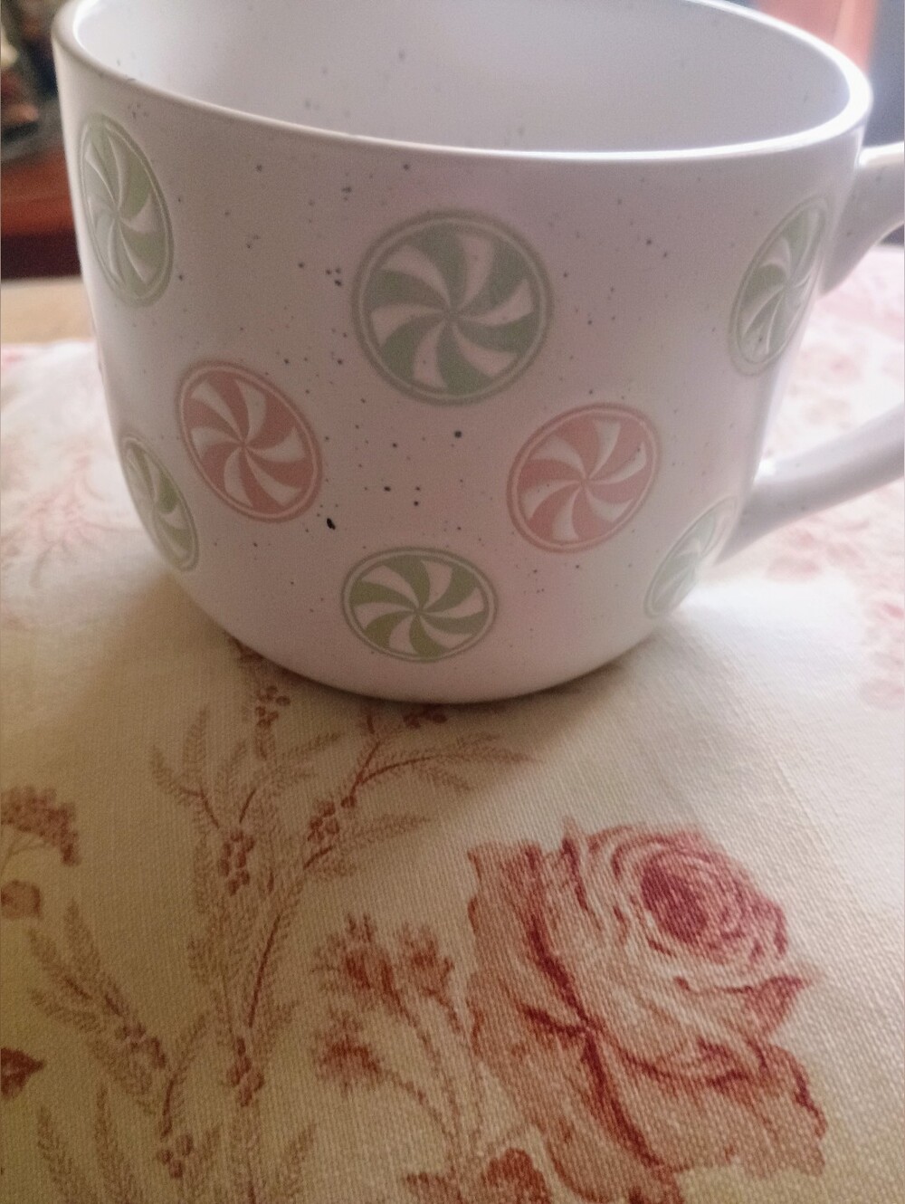 White Ceramic Mug with Pastel Green and Pink Pinwheel Design